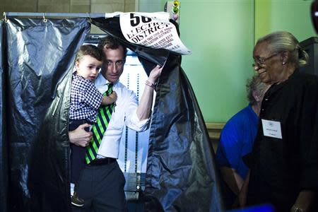 New York City Democratic candidate Anthony Weiner exits the voting booth with his son, Jordan Weiner, after voting at his polling center in the primary election in New York September 10, 2013. REUTERS/Eduardo Munoz