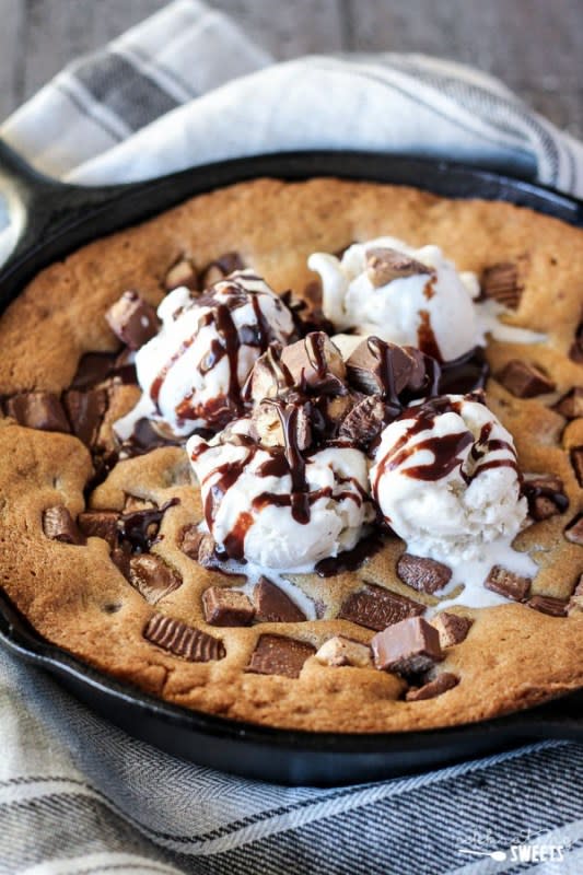 <p>Celebrating Sweets</p><p>A soft and gooey deep-dish cookie baked in a skillet and loaded with your favorite candy bars! Serve warm with ice cream and hot fudge sauce. </p><p><strong>Get the recipe: </strong><strong><a href="https://celebratingsweets.com/candy-bar-skillet-cookie-video/" rel="nofollow noopener" target="_blank" data-ylk="slk:Candy Bar Skillet Cookie;elm:context_link;itc:0;sec:content-canvas" class="link ">Candy Bar Skillet Cookie</a></strong></p><p><strong>Related: <a href="https://finance.yahoo.com/news/35-creepy-cute-halloween-food-172334096.html" data-ylk="slk:35+ Creepy-Cute Halloween Food and Drink Recipes;elm:context_link;itc:0;sec:content-canvas;outcm:mb_qualified_link;_E:mb_qualified_link;ct:story;" class="link  yahoo-link">35+ Creepy-Cute Halloween Food and Drink Recipes</a></strong></p>