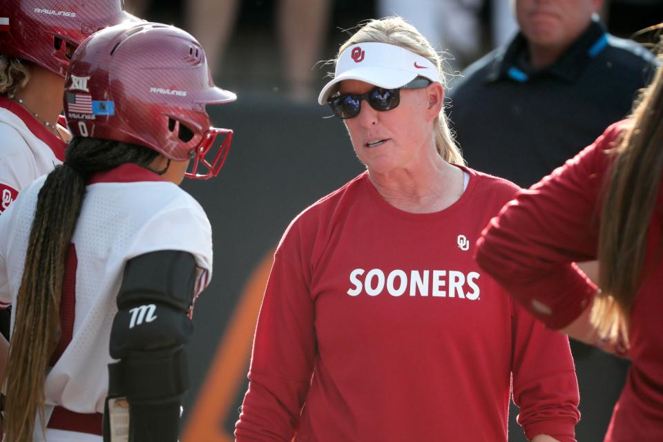 OU coach Patty Gasso talks to her team during a 4-2 win at OSU on Saturday in Stillwater.