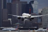 FILE - A Delta Air Lines plane lands at Logan International Airport, Thursday, Jan. 26, 2023, in Boston. On July 11, 2024, Delta Air Lines said its second-quarter profit is down 29% from a year earlier, and it's giving a disappointing outlook for the third quarter. (AP Photo/Michael Dwyer, File)