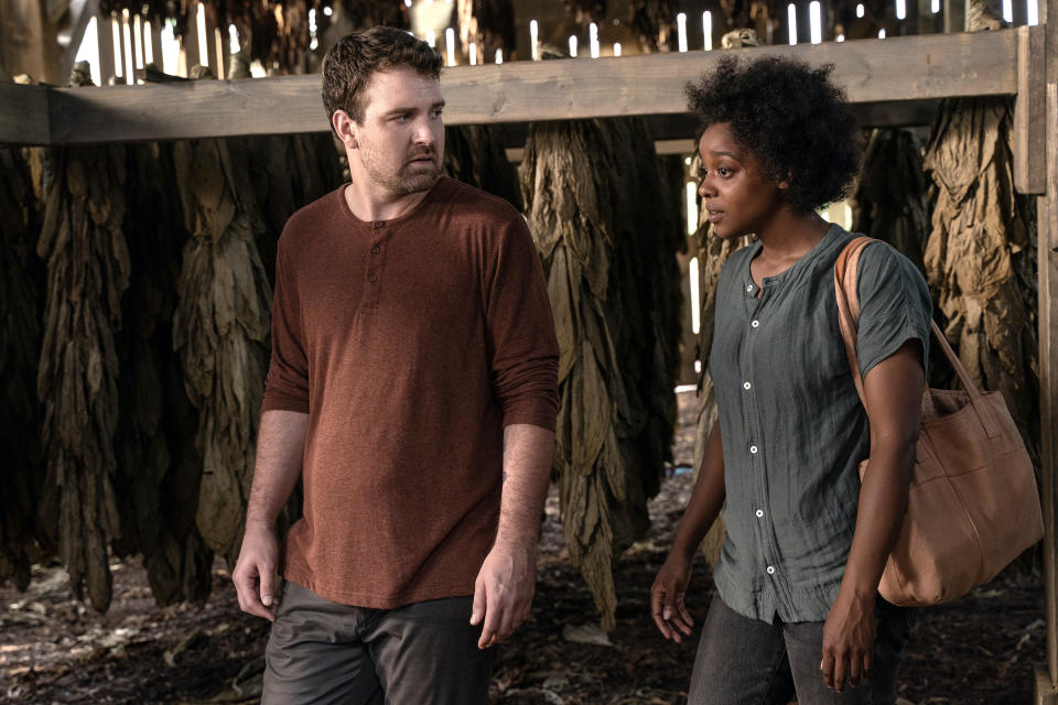 Kevin (Micah Stock) and Dana (Mallori Johnson) walk through the plantation's barn together.<span class="copyright">Richard Ducree—FX Networks</span>