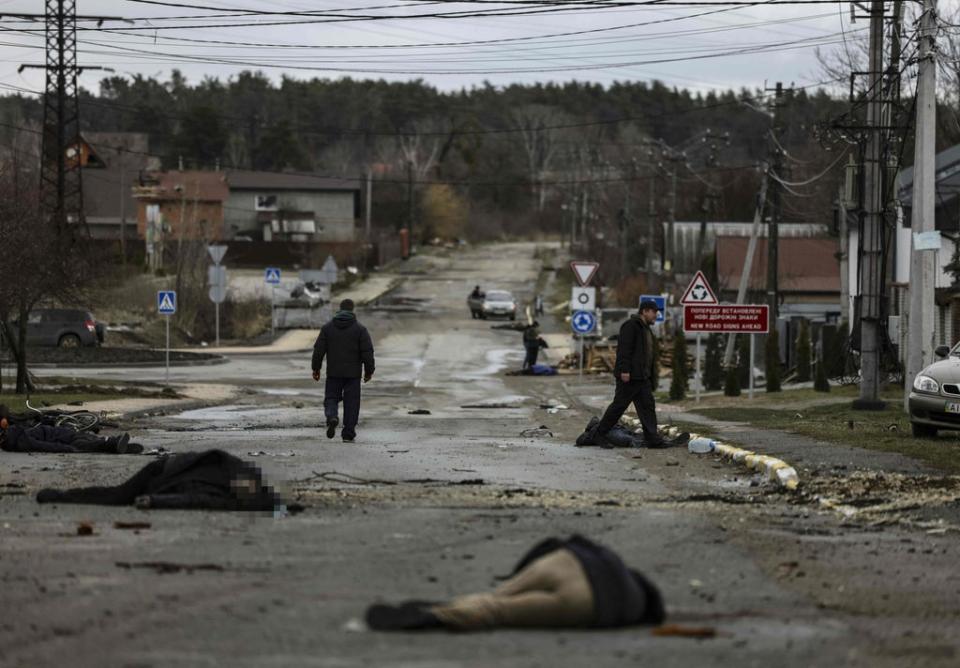 Bodies lie on a street in Bucha (AFP/Getty)