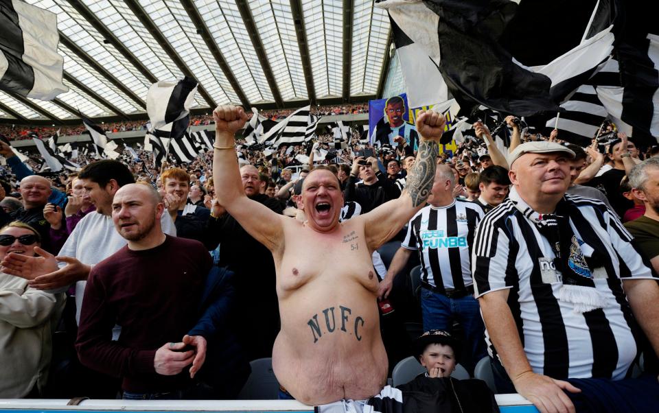 A Newcastle fan - AP Photo/Jon Super