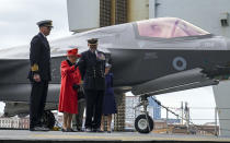 Britain's Queen Elizabeth II visits the HMS Queen Elizabeth at HM Naval Base, ahead of the ship's maiden deployment, in Portsmouth, England, Saturday May 22, 2021. HMS Queen Elizabeth will be leading a 28-week deployment to the Far East that Prime Minister Boris Johnson has insisted is not confrontational towards China. (Steve Parsons/Pool Photo via AP)