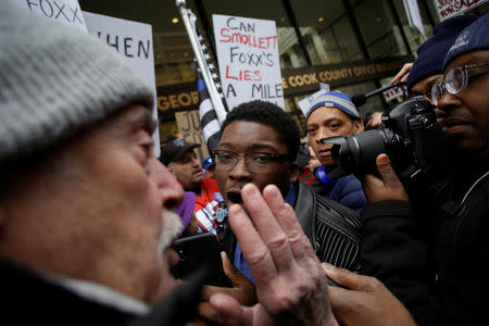 Ja'Mal Green faces off with a Fraternal Order of Police supporter protesting the handling of the Jussie Smollett case by the State's Attorney Kim Foxx in Chicago, Illinois, U.S., April 1, 2019. REUTERS/Joshua Lott