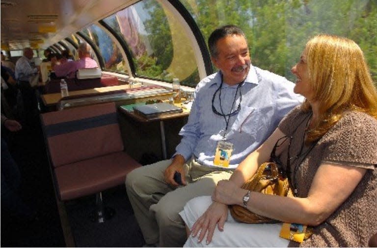 Michael Busha, executive director of the Treasure Coast Regional Planning Council, and his wife Pam, commissioner of the town of Sewall's Point, enjoy the ride and view of the upper deck of a domed passenger car May 1, 2010, while riding on the Amtrak-Florida East Coast inspection train through St. Lucie County between stops in Stuart and Fort Pierce. "Love it. Like to see it happen on a regular basis." Michael Busha said about the trip. "Got to get passengers back on the FEC again. This is great." The train was en route from Miami to Jacksonville with stops in Stuart, Fort Pierce and Vero Beach for a feasibility review of passenger rail service.