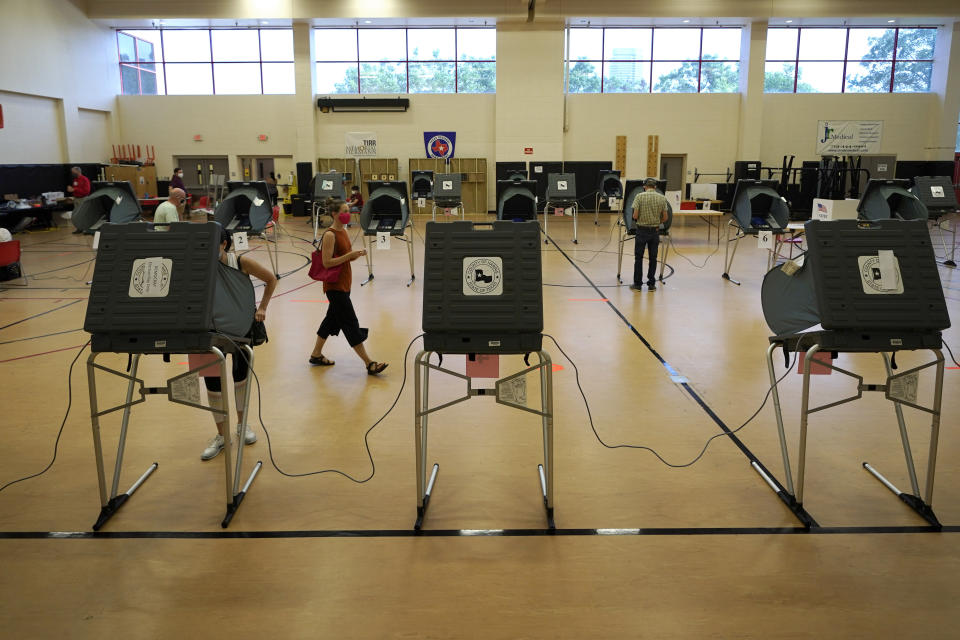 Voters cast their ballots, Tuesday, July 14, 2020, in Houston. (AP Photo/David J. Phillip)