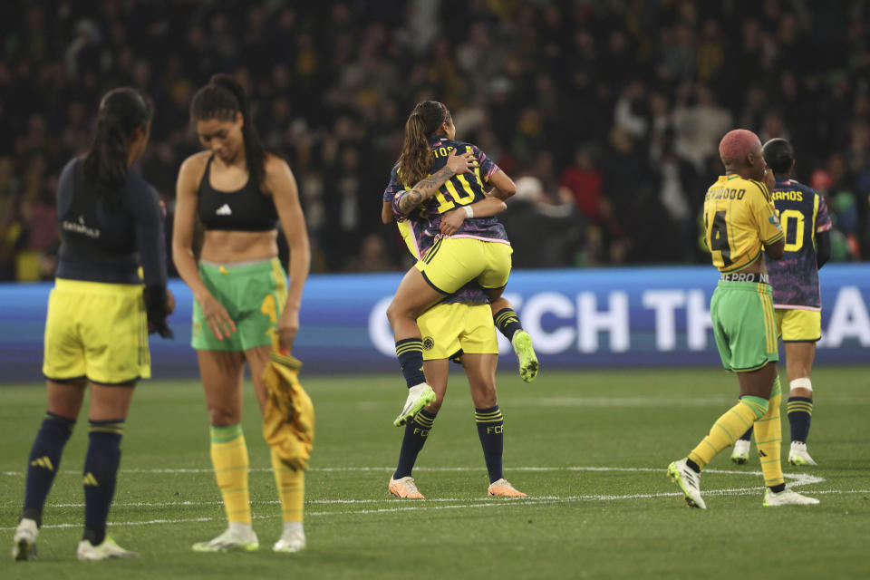 Colombia's players celebrate at the end of the Women's World Cup round of 16 soccer match between Jamaica and Colombia in Melbourne, Australia, Tuesday, Aug. 8, 2023. (AP Photo/Hamish Blair)