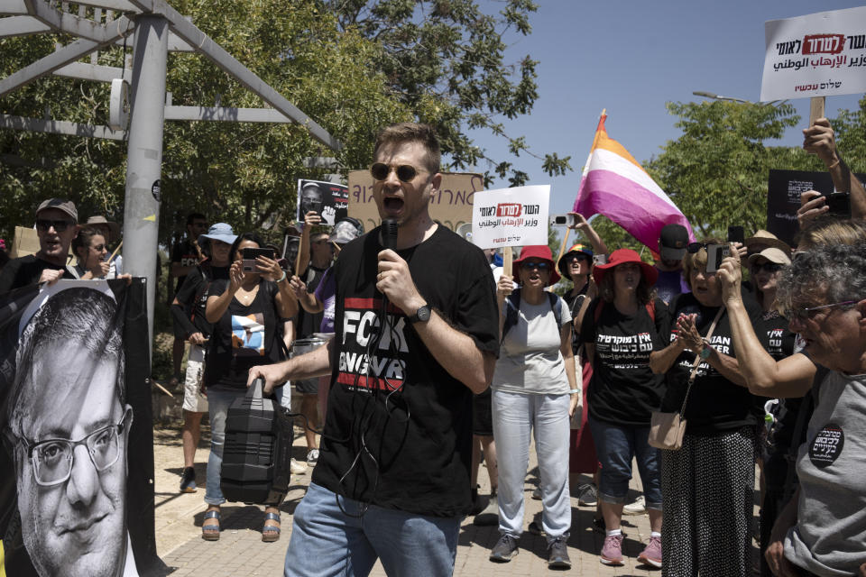 Avner Gvaryahu of Breaking the Silence speaks to Israelis protesting near the home of far-right National Security Minister Itamar Ben Gvir against plans by Benjamin Netanyahu's government efforts to overhaul the judiciary, in the West Bank settlement of Kiryat Arba, Friday, Aug. 25, 2023. (AP Photo/Maya Alleruzzo)