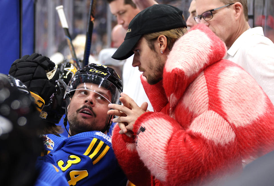 TORONTO, ONTARIO - FEBRUARY 03: Justin Bieber talks with Auston Matthews #34 of the Toronto Maple Leafs of Team Matthews on the bench during their game against Team McDavid during the 2024 Honda NHL All-Star Game at Scotiabank Arena on February 03, 2024 in Toronto, Ontario, Canada. (Photo by Dave Sandford/NHLI via Getty Images)