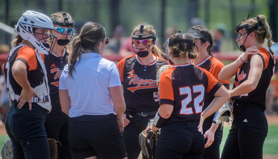 Illini Bluffs head coach Lindsey Lox talks with the Tigers in the third inning of the Class 1A softball state title game Saturday, June 3, 2023 at the Louisville Slugger Sports Complex in Peoria. The defending champion Tigers fell to the St. Bede Lady Bruins 7-6.