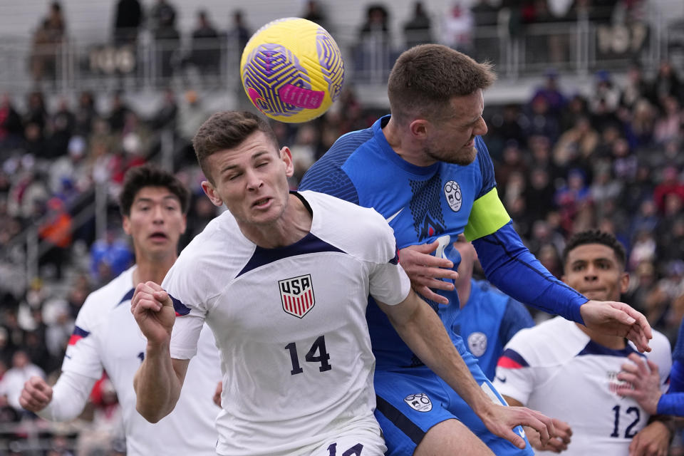 United States midfielder Sean Zawadzki (14) and Slovenia midfielder Timi Max Elsnik vie for a head ball during the first half of an international friendly soccer match in San Antonio, Saturday, Jan. 20, 2024. (AP Photo/Eric Gay)