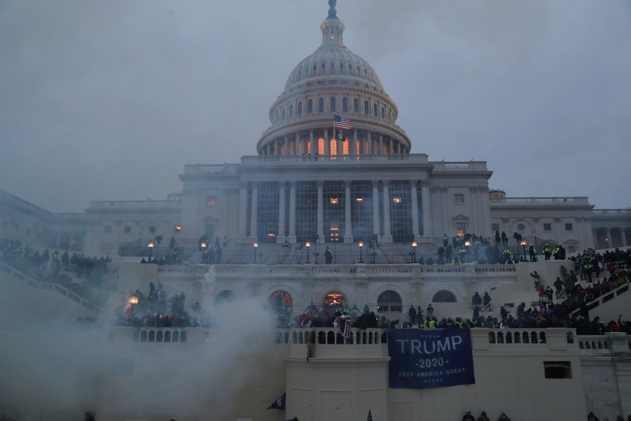 <p>Supporters of U.S. President Donald Trump clash with police officers in front of the U.S. Capitol Building in Washington, U.S., January 6, 2021. </p> (REUTERS/Leah Millis)