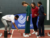 Britain's Catherine, Duchess of Cambridge, gets instruction on how to use the starting blocks on a running track during a SportsAid event at the London Stadium in east London on February 26, 2020. (Photo by Yui Mok / POOL / AFP) (Photo by YUI MOK/POOL/AFP via Getty Images)