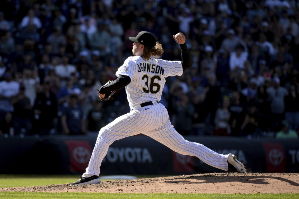 Colorado Rockies relief pitcher Pierce Johnson closes in the ninth inning of a baseball game against the Washington Nationals Sunday, April 9, 2023, in Denver. (AP Photo/Geneva Heffernan)