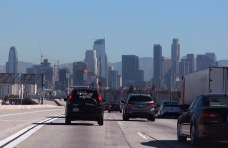 FILE PHOTO: A highway carpool lane sits empty as traffic makes its way into Los Angeles