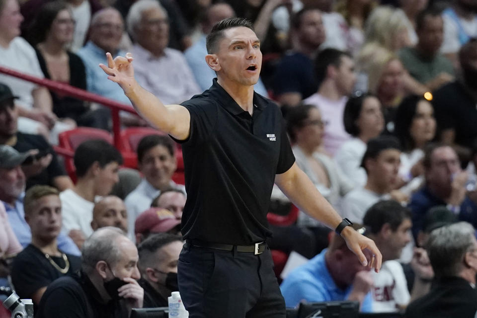 FILE - Miami Heat assistant coach Chris Quinn gestures during the first half of the team's NBA basketball game against the Charlotte Hornets, April 5, 2022, in Miami. Cleveland added two more candidates to its coaching search Friday, May 31, 2024, receiving permission to interview Quinn and New York Knicks assistant Johnnie Bryant, a person familiar with the process told the Associated Press. (AP Photo/Lynne Sladky, File)