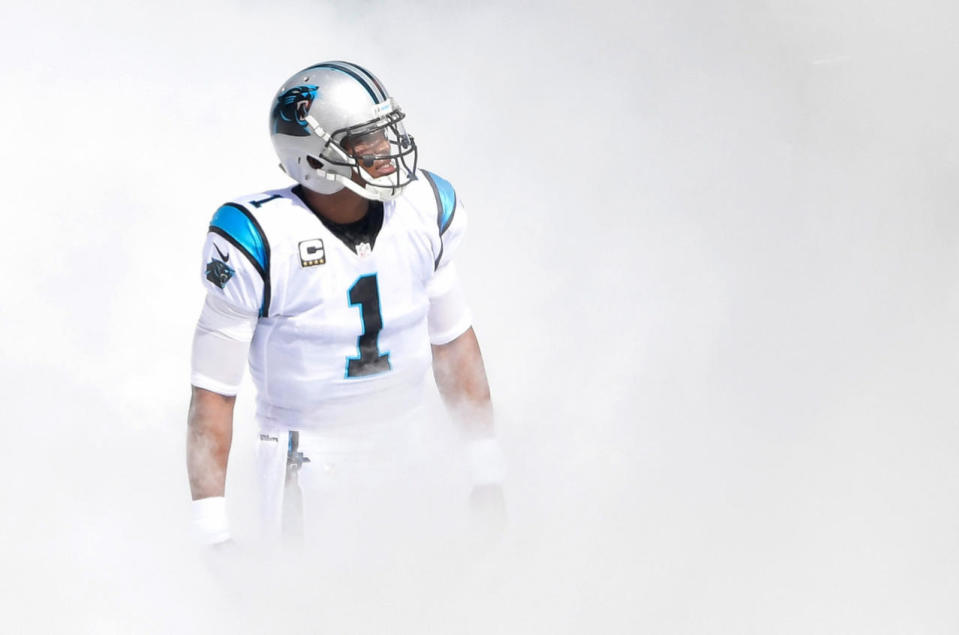 Cam Newton emerges from the smoke