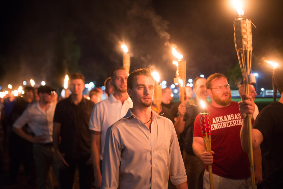 <p>Neo-Nazis, Alt-Right, and White Supremacists take part the night before the ‘Unite the Right’ rally in Charlottesville, Va. White supremacists march with tiki torchs through the University of Virginia campus, Aug. 11, 2017. (Photo: Zach D. Roberts/NurPhoto via Getty Images) </p>