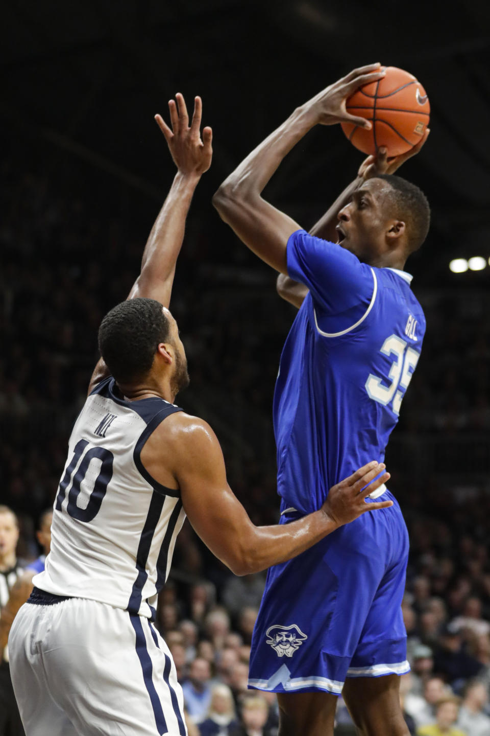 Seton Hall center Romaro Gill (35) shoots over Butler forward Bryce Nze (10) in the second half of an NCAA college basketball game in Indianapolis, Wednesday, Jan. 15, 2020. Seton Hall defeated Butler 78-70. (AP Photo/Michael Conroy)