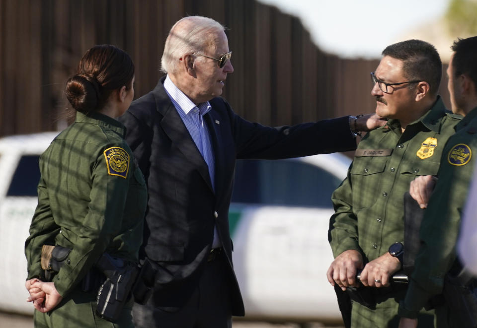 President Joe Biden talks with U.S. Border Patrol agents as they stand along a stretch of the U.S.-Mexico border in El Paso Texas, Sunday, Jan. 8, 2023. (AP Photo/Andrew Harnik)