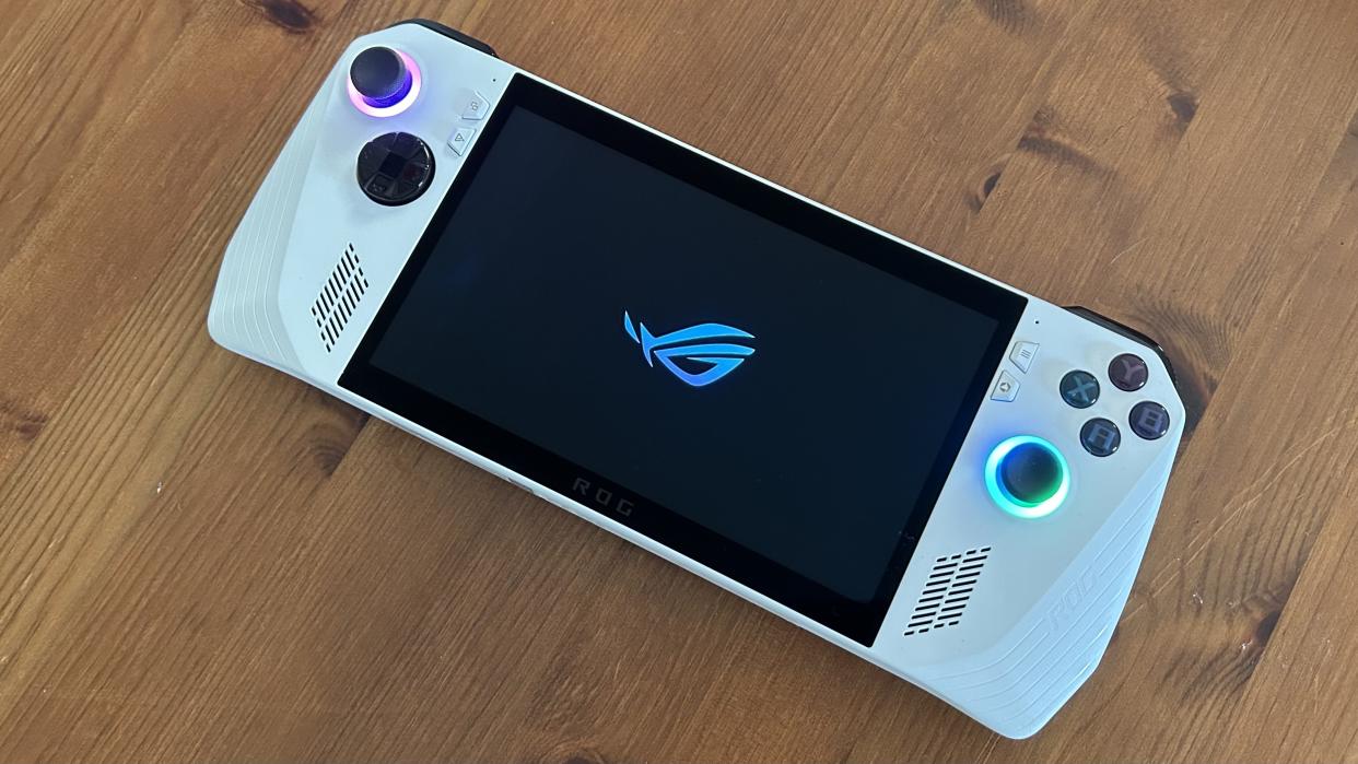  Asus ROG Ally handheld on a wooden table. 