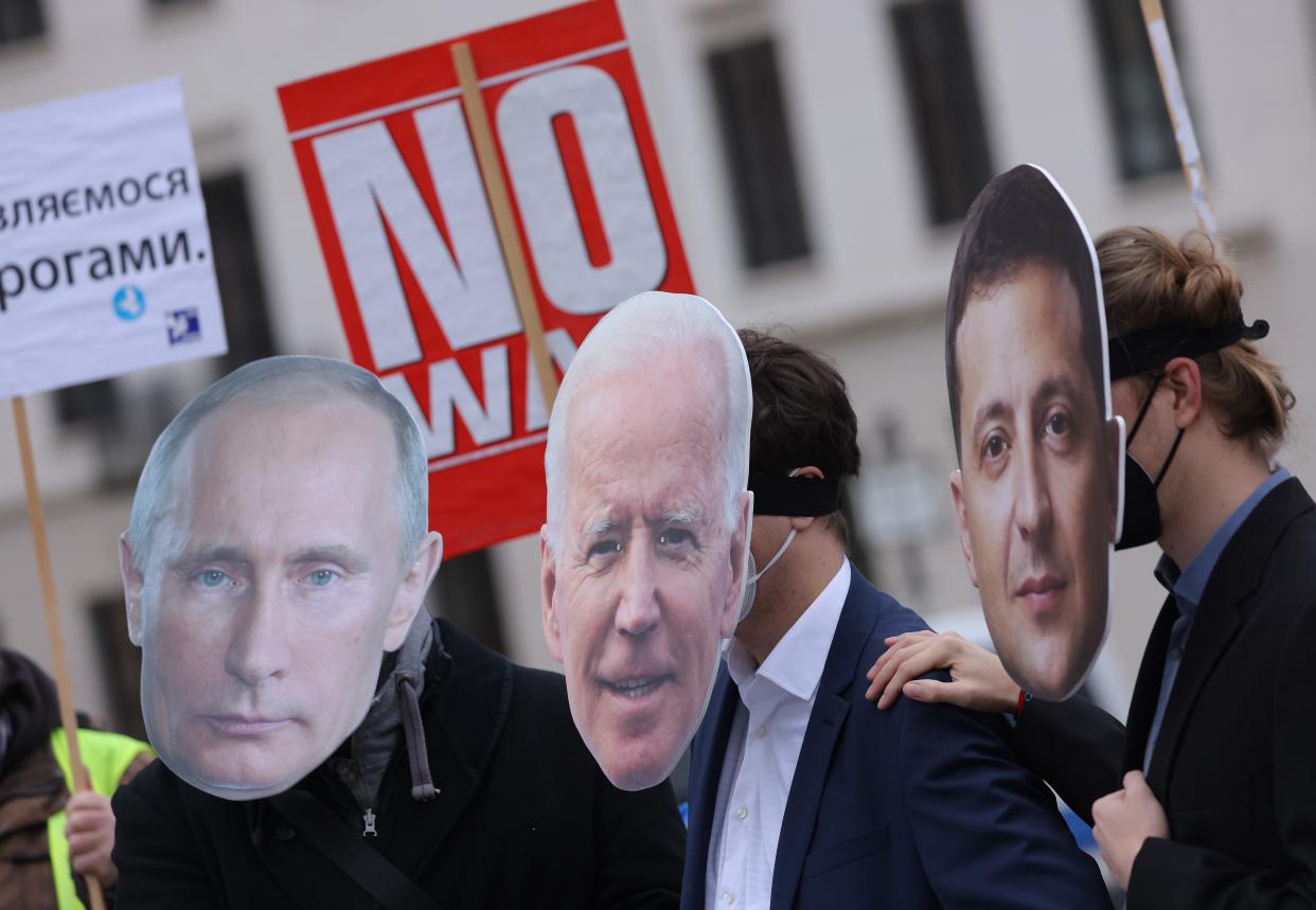 Antiwar protesters depicting Vladimir Putin, Joe Biden and Volodymyr Zelenskyy rally in Berlin in February.