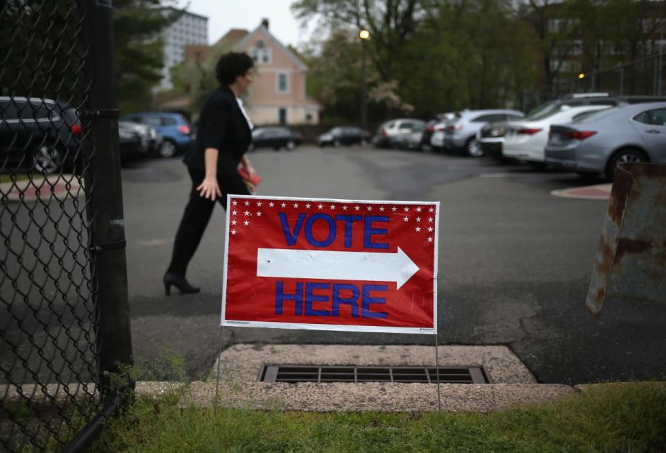 A voter arrives in Stamford