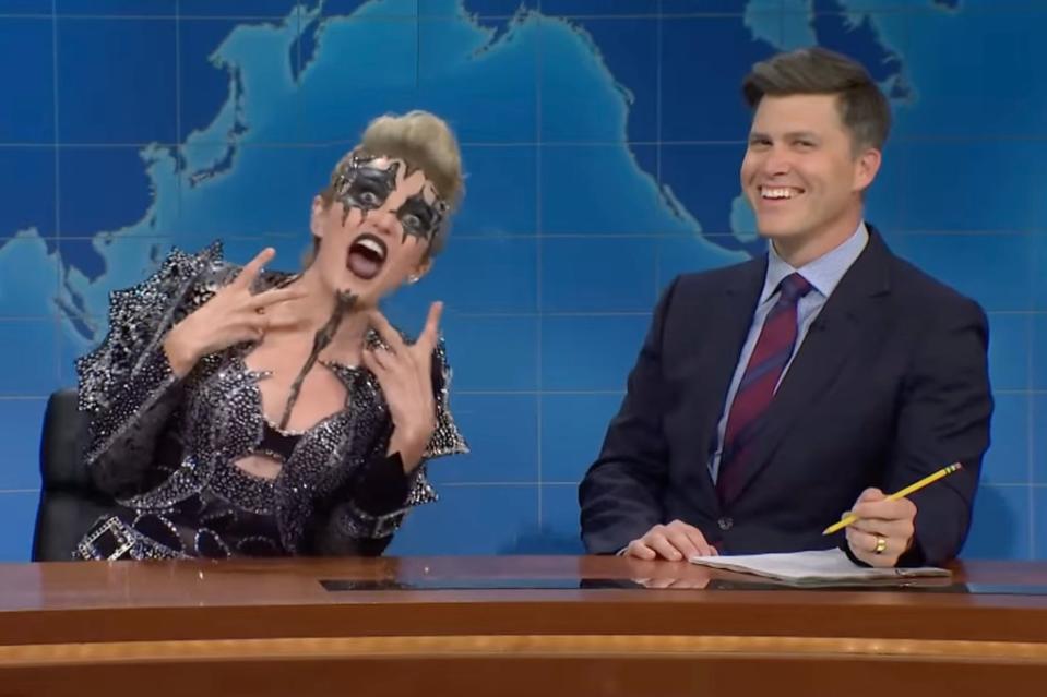 Chloe Fineman as JoJo Siwa with the Weekend Update host Colin Jost on “SNL.” SNL