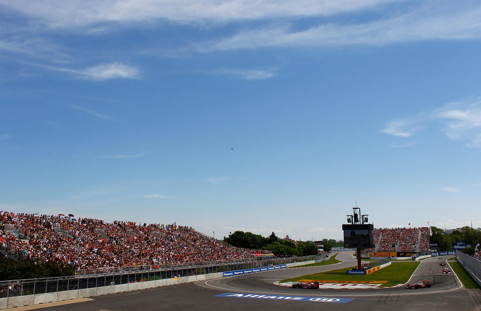 MONTREAL, CANADA - JUNE 10: Sebastian Vettel of Germany and Red Bull Racing leads after the start of the Canadian Formula One Grand Prix at the Circuit Gilles Villeneuve on June 10, 2012 in Montreal, Canada. (Photo by Vladimir Rys/Getty Images)