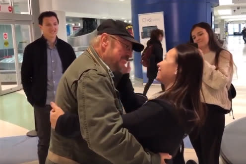 John George, left, meeting his daughter, Loan Ho, for the first time | Randy Ho