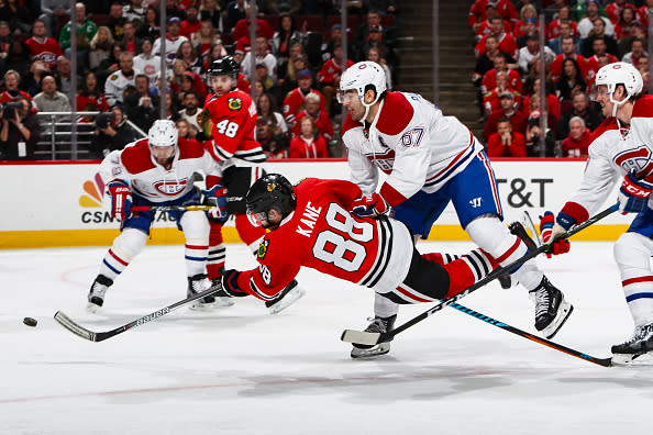 CHICAGO, IL - NOVEMBER 13: Patrick Kane #88 of the Chicago Blackhawks shoots the puck against Max Pacioretty #67 and Jeff Petry #26 of the Montreal Canadiens, resulting in a goal in the second period, at the United Center on November 13, 2016 in Chicago, Illinois. (Photo by Chase Agnello-Dean/NHLI via Getty Images)