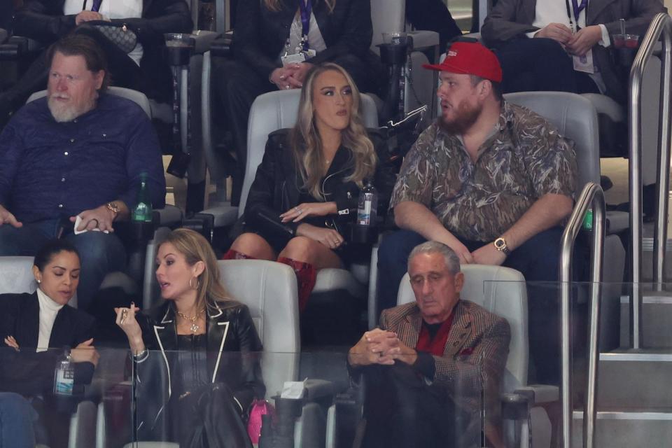 PHOTO: Singer Luke Combs watches Super Bowl LVIII between the San Francisco 49ers and Kansas City Chiefs, Feb. 11, 2024, in Las Vegas. (Rob Carr/Getty Images)