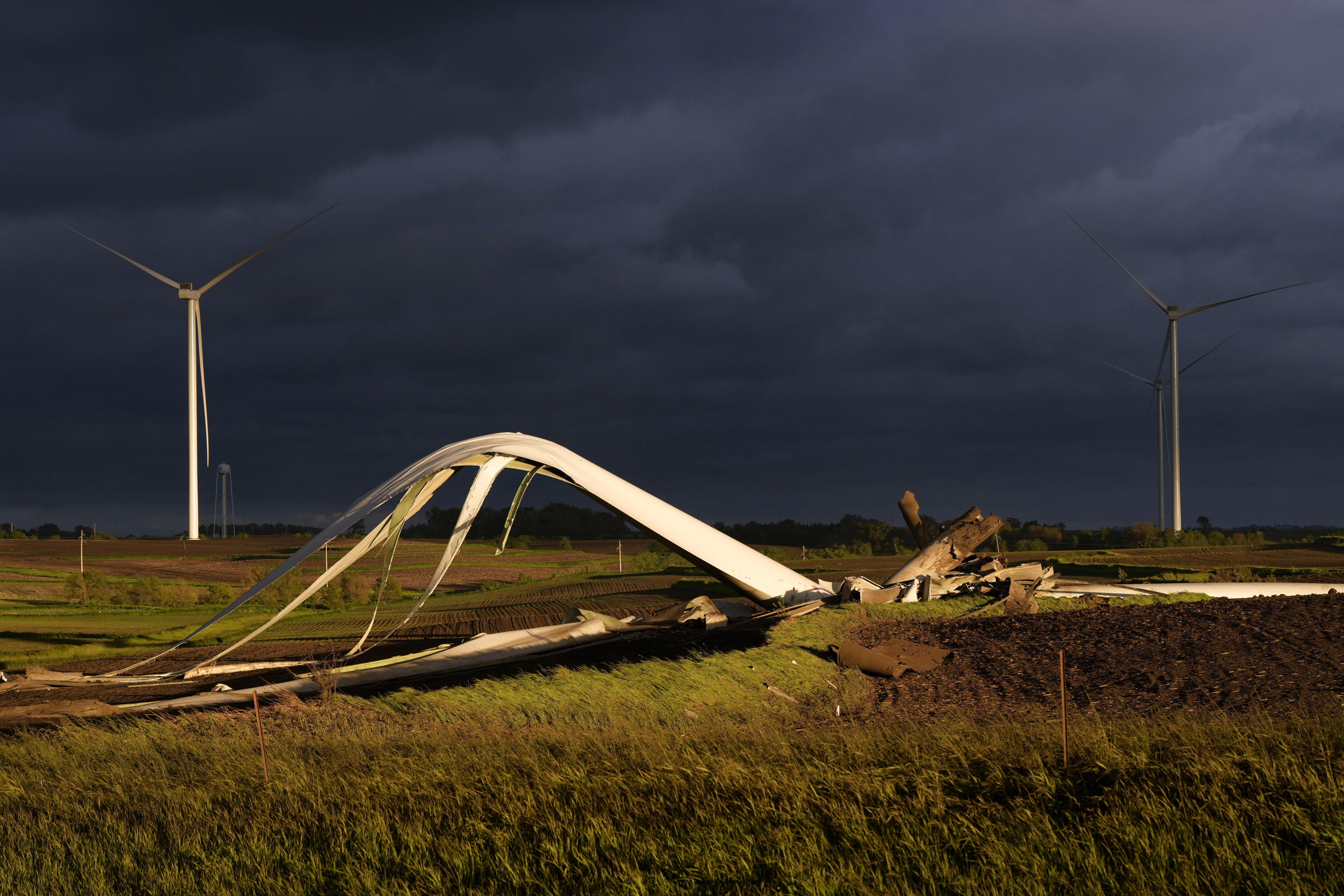 The remains of a tornado-damaged wind turbine in a field on Tuesday near Prescott, Iowa.