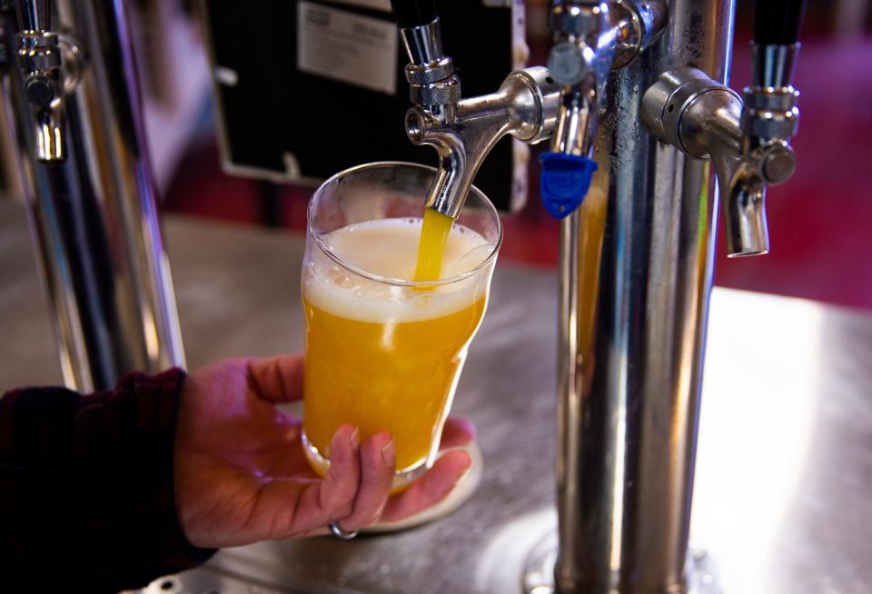 Cam Wells pours a This is the Haze hazy IPA at Arable Brewing.