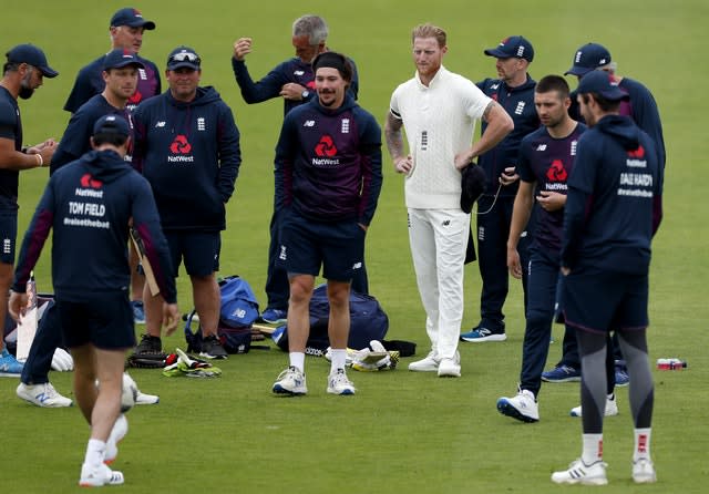 England captain Ben Stokes, fourth right, and his team warm up on the pitch 