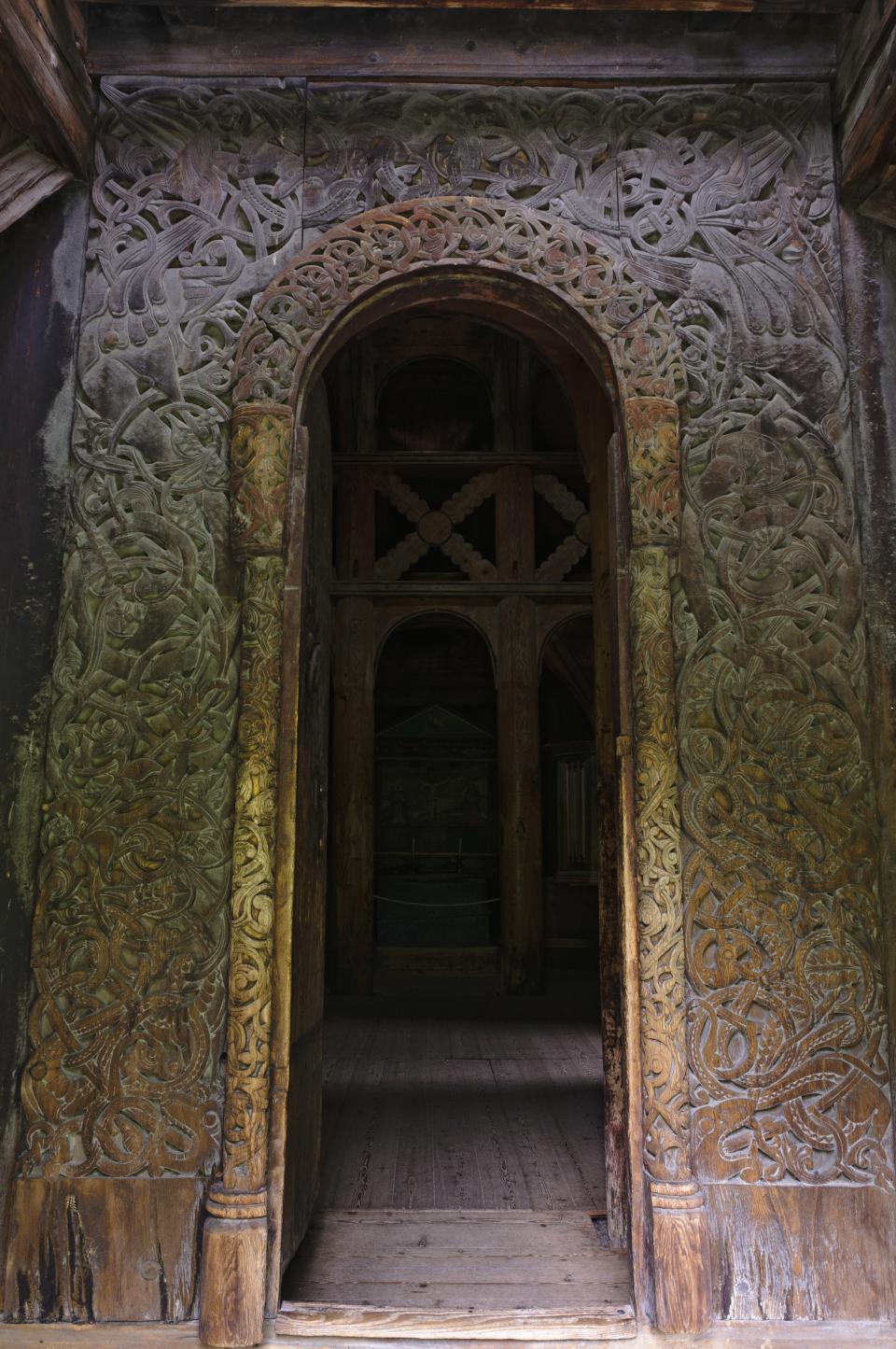 <h1 class="title">Carvings around main doorway in Borgund stave church.</h1><cite class="credit">Photo by Grant Dixon. Image courtesy of Getty.</cite>