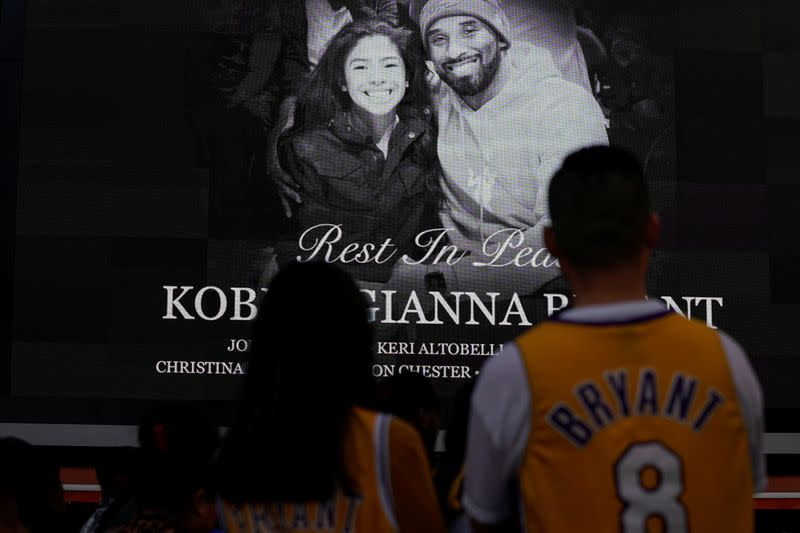 Fans of NBA basketball star Kobe Bryant pay their respects at a memorial outside the Staples Center at L.A. Live in Los Angeles