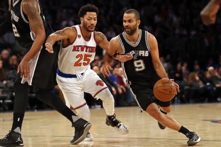 Feb 12, 2017; New York, NY, USA; San Antonio Spurs guard Tony Parker (9) drives to the basket past New York Knicks guard Derrick Rose (25) during the second half at Madison Square Garden. Mandatory Credit: Adam Hunger-USA TODAY Sports