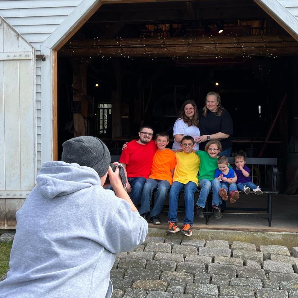 Local photographer Janelle LaPointe snaps some shots of a family who came to the Mattapoisett Museum to participate in Tri-Town Against Racism's Diverse Family Portrait project last spring. Organizers said the purpose of the project was to highlight the diversity within the communities of Mattapoisett, Marion and Rochester.