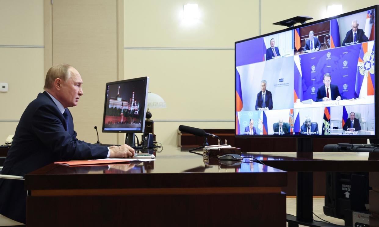 <span>Vladimir Putin chairing a videoconference meeting of his security council.</span><span>Photograph: Alexander Kazakov/AP</span>