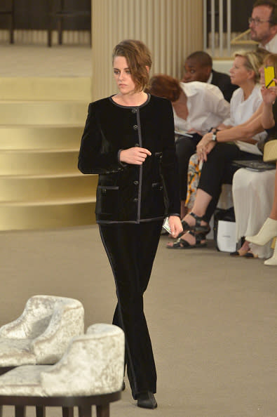 <p>Kristen Stewart, who’s the face of Chanel’s most recent handbag campaign alongside Vanessa Paradis, and Alice Dellal, kicked the show off by walking to her seat at a blackjack table in the middle of the show. She wore a Chanel ensemble that, despite the brand’s girliness, still catered to the actress’ darker sense of style.</p>