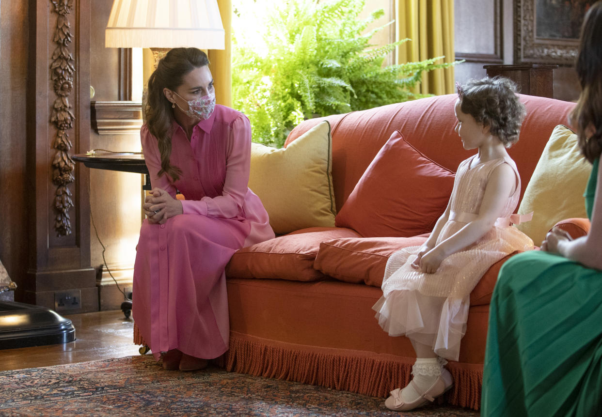 The Duchess of Cambridge and cancer patient, Mila Sneddon,coordinate in pink dresses for their in-person meet up during the duchess' royal tour of Scotland. (PA Images)