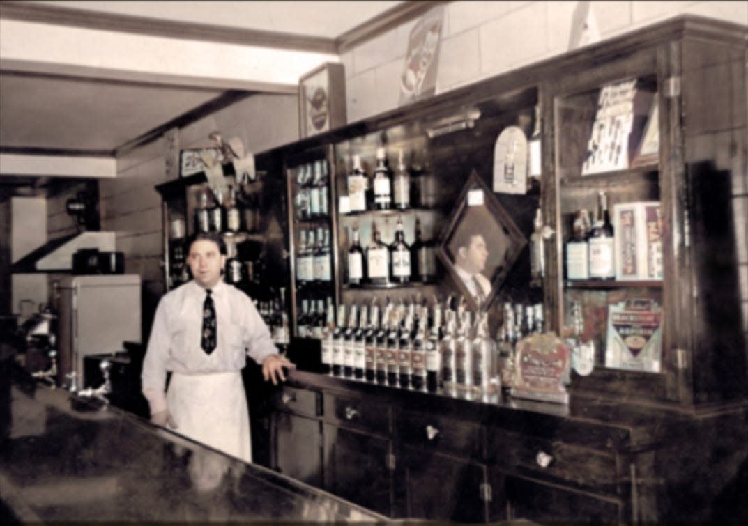 This photo, used on the cover of "A Boyhood At Red's" by Tom Romano, shows the author's father, Philip "Red" Romano, in the bar he operated in Malvern.