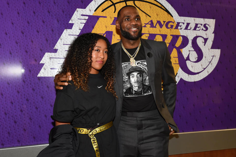 LOS ANGELES, CA - APRIL 4: Tennis Player, Naomi Osaka poses for a photo with LeBron James #23 of the Los Angeles Lakers after the game on April 4, 2019 at STAPLES Center in Los Angeles, California. NOTE TO USER: User expressly acknowledges and agrees that, by downloading and/or using this Photograph, user is consenting to the terms and conditions of the Getty Images License Agreement. Mandatory Copyright Notice: Copyright 2019 NBAE (Photo by Andrew D. Bernstein/NBAE via Getty Images)