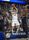 Arizona guard T.J. McConnell (4) (4) shoots over San Diego State forward Winston Shepard (13) and San Diego State forward Skylar Spencer (0) during the first half in a regional semifinal NCAA college basketball tournament game, Thursday, March 27, 2014, in Anaheim, Calif. (AP Photo/Mark J. Terrill)