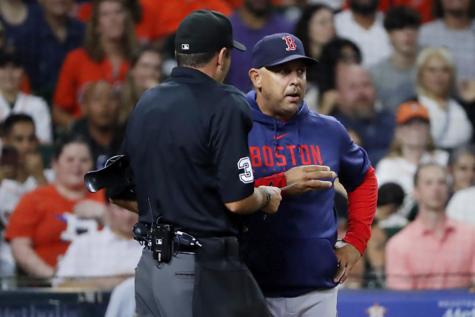 Boston Red Sox manager Alex Cora talks with umpire Pat Hoberg after Hoberg ejected Alex Verdugo during the fourth inning of a baseball game against the Houston Astros, Tuesday, Aug. 22, 2023, in Houston. (AP Photo/Michael Wyke)