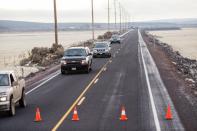 Vehicles exit Highway 78 approximately 4 miles from the Malheur Wildlife Refuge Headquarters near Burns, Oregon on January 27, 2016