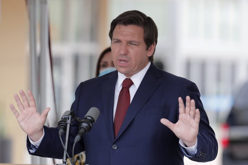 In this May 14, 2020, file photo, Florida Gov. Ron DeSantis speaks at a news conference in Doral, Fla.