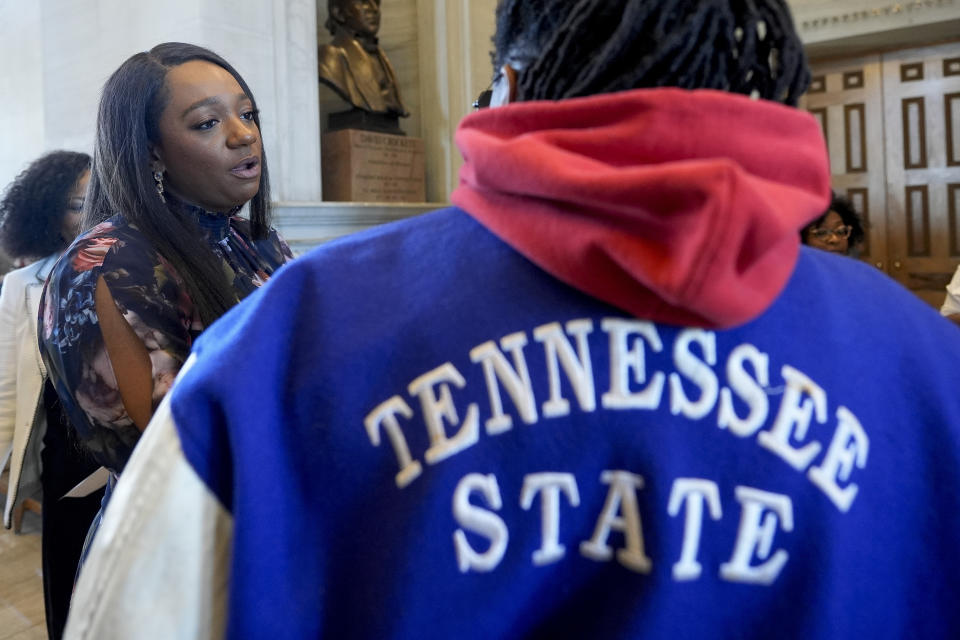 State Sen. London Lamar, D-Memphis, speaks to a Tennessee State University supporter outside the legislative chambers Thursday, March 28, 2024, in Nashville, Tenn. The House voted to vacate the school's board of trustees. (AP Photo/George Walker IV)